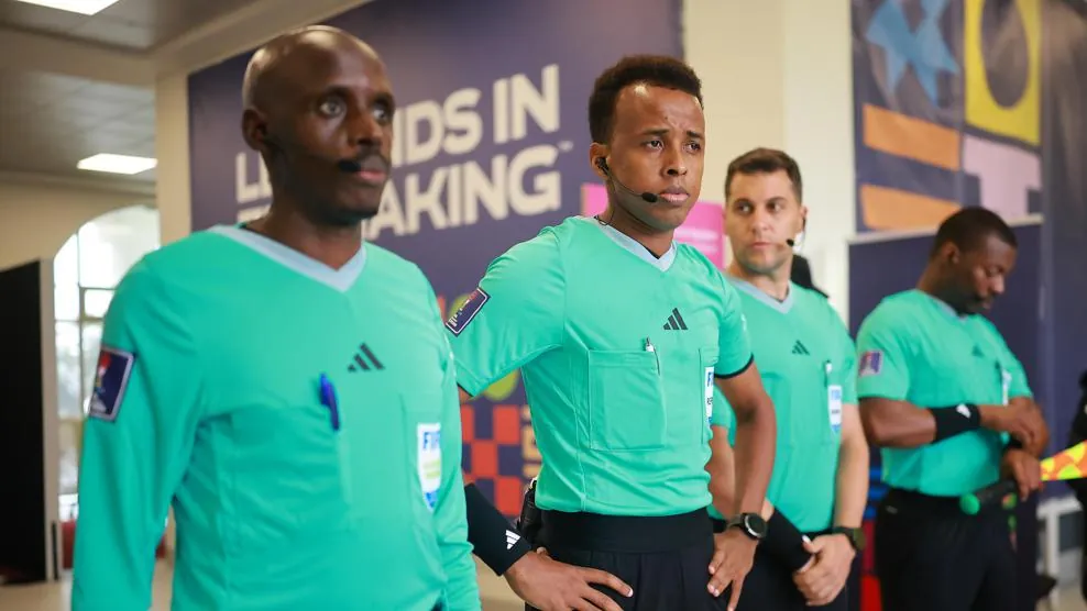 Artan, middle, began his refereeing journey early in life